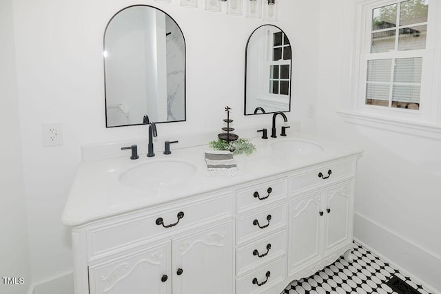 103 N Mckay Ave, Dunn, NC 28334 - full bath featuring double vanity and baseboards