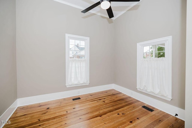 103 N Mckay Ave, Dunn, NC 28334 - unfurnished room featuring plenty of natural light, crown molding, hardwood / wood-style flooring, and ceiling fan