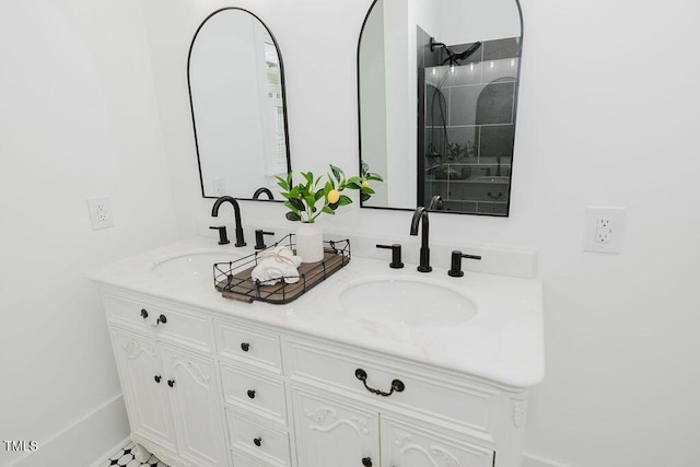 103 N Mckay Ave, Dunn, NC 28334 - bathroom featuring double vanity and a shower