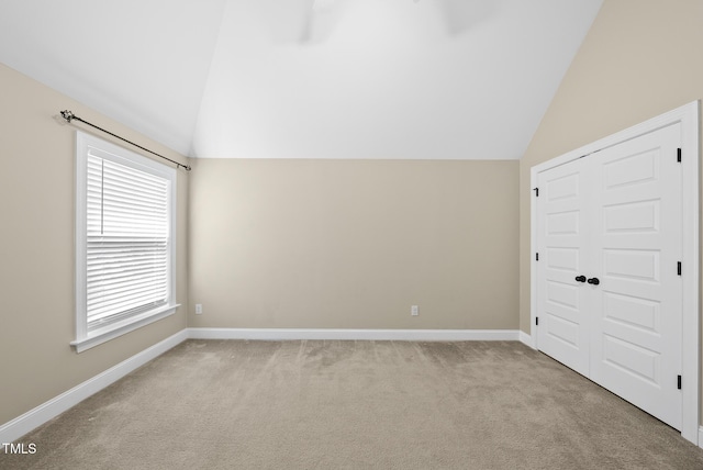 347 Country Mill Way, Fuquay Varina, NC 27526 - unfurnished bedroom featuring lofted ceiling, carpet floors, and a closet