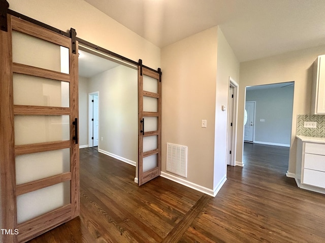 6 First St, Franklinton, NC 27525 - corridor with a barn door and dark wood finished floors