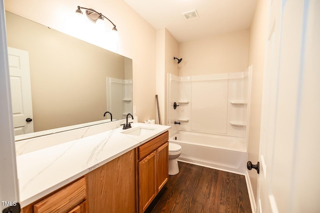 6 First St, Franklinton, NC 27525 - bathroom with vanity, wood finished floors, and bathtub / shower combination