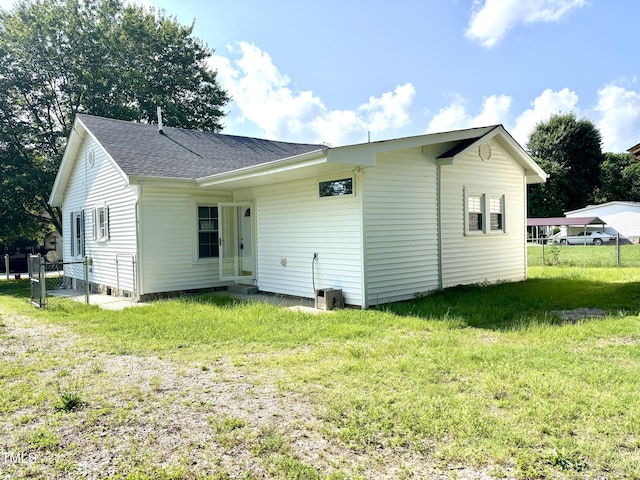 6 First St, Franklinton, NC 27525 - rear view of property with a shingled roof