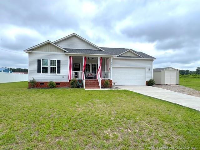 893 Blanchard Rd, Saint Pauls, NC 28384 - single story home featuring covered porch, a garage, concrete driveway, a storage unit, and crawl space
