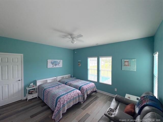 893 Blanchard Rd, Saint Pauls, NC 28384 - bedroom with wood finished floors and ceiling fan