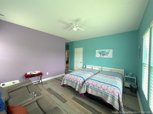 893 Blanchard Rd, Saint Pauls, NC 28384 - bedroom featuring wood finished floors and ceiling fan