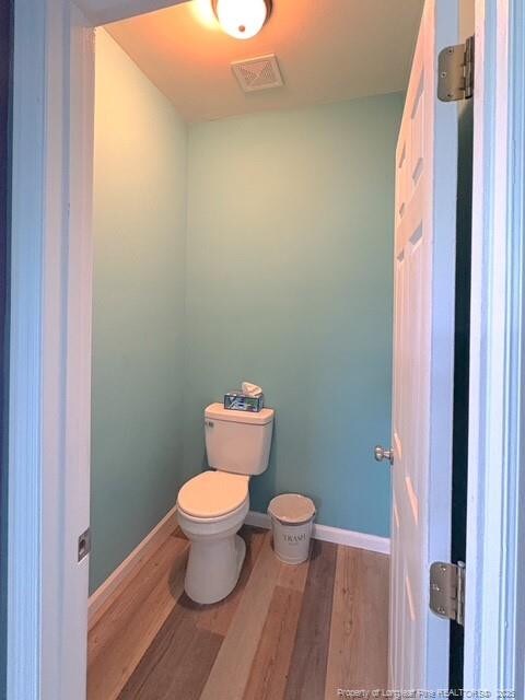 893 Blanchard Rd, Saint Pauls, NC 28384 - bathroom featuring wood finished floors and toilet