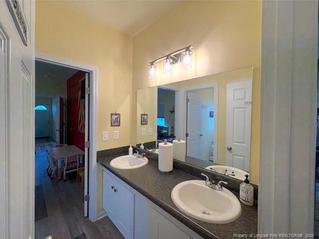 893 Blanchard Rd, Saint Pauls, NC 28384 - full bath featuring double vanity and wood finished floors