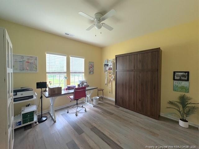 893 Blanchard Rd, Saint Pauls, NC 28384 - office space featuring a ceiling fan and wood finished floors