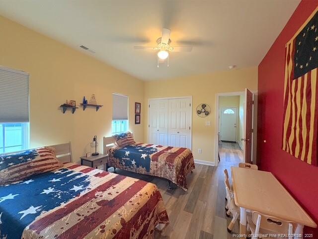 893 Blanchard Rd, Saint Pauls, NC 28384 - bedroom featuring wood finished floors, a ceiling fan, and a closet