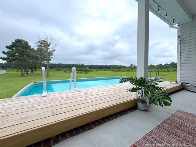 893 Blanchard Rd, Saint Pauls, NC 28384 - swimming pool with a yard and a wooden deck