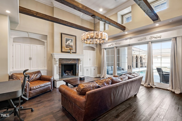 19 San Rimini Way, Durham, NC 27707 - living area featuring ornamental molding, dark wood finished floors, a chandelier, healthy amount of natural light, and a high ceiling