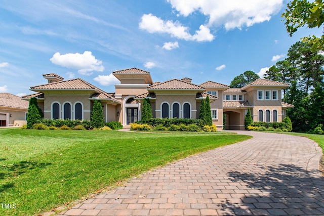 19 San Rimini Way, Durham, NC 27707 - mediterranean / spanish home featuring stucco siding, french doors, a front yard, driveway, and a tiled roof