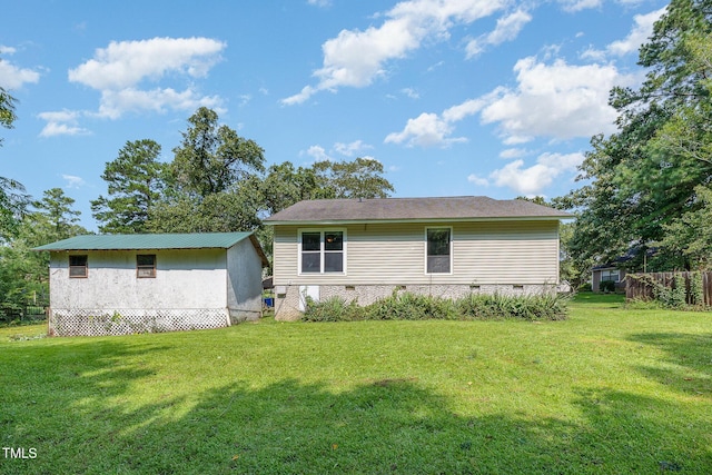 5700 Eagle Pass Cir, Fayetteville, NC 28304 - rear view of property with a yard, crawl space, and a storage shed