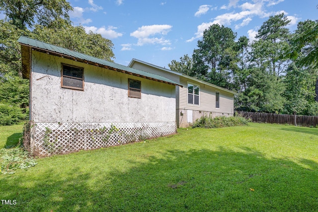 5700 Eagle Pass Cir, Fayetteville, NC 28304 - view of side of property featuring stucco siding and a metal roof