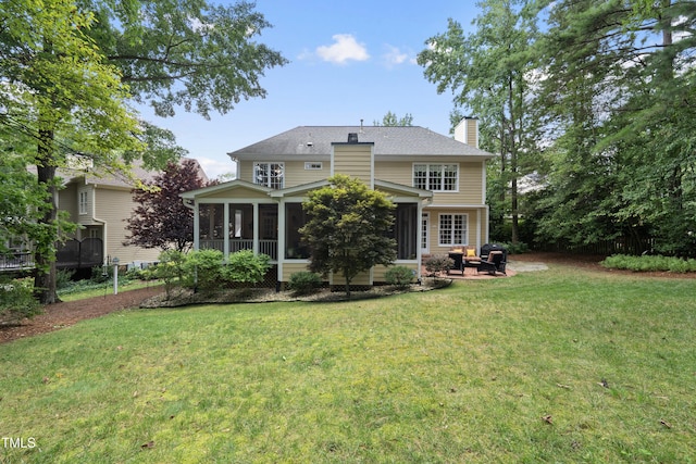 107 Ackworth Ct, Cary, NC 27519 - back of house with a chimney, a sunroom, a lawn, and a patio