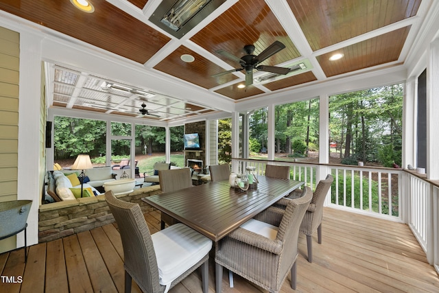 107 Ackworth Ct, Cary, NC 27519 - sunroom with ceiling fan, coffered ceiling, outdoor dining space, plenty of natural light, and beamed ceiling