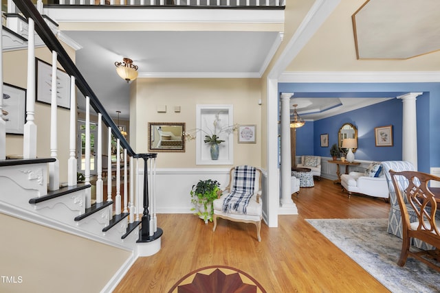 107 Ackworth Ct, Cary, NC 27519 - foyer with decorative columns, wood finished floors, ornamental molding, and stairway