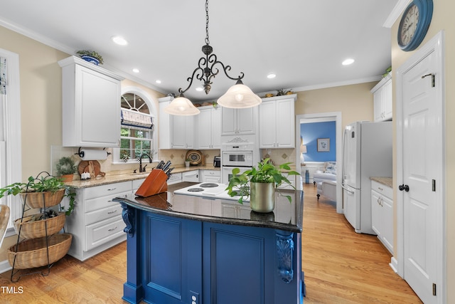 107 Ackworth Ct, Cary, NC 27519 - kitchen with white appliances, white cabinetry, ornamental molding, a center island, and pendant lighting