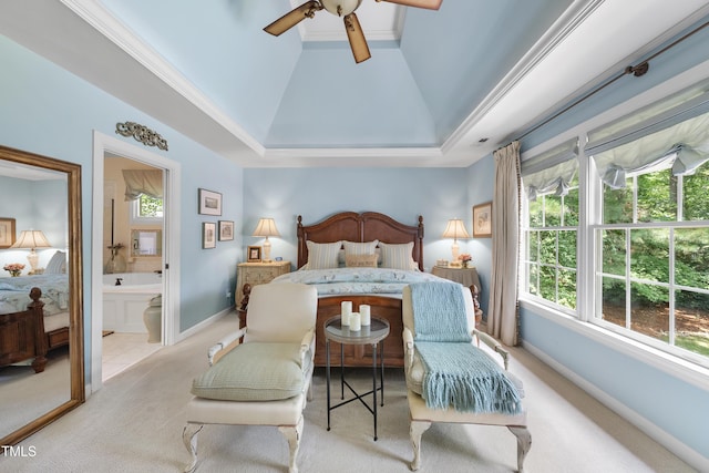 107 Ackworth Ct, Cary, NC 27519 - carpeted bedroom with vaulted ceiling, a tray ceiling, ensuite bath, and a ceiling fan