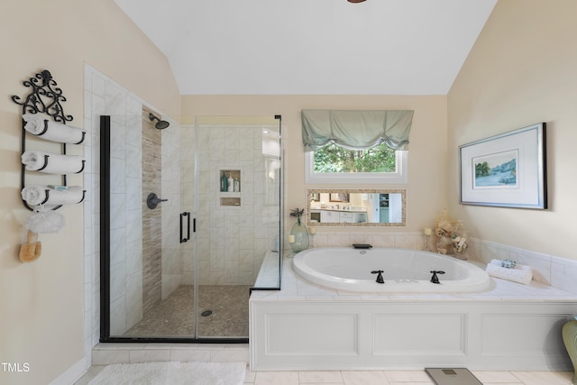 107 Ackworth Ct, Cary, NC 27519 - bathroom with vaulted ceiling, a bath, and a shower stall