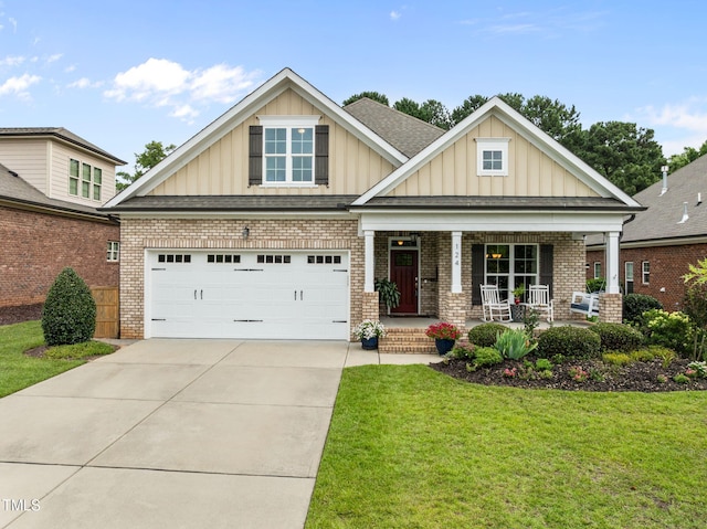124 Moss Creek Pl, Fuquay Varina, NC 27526 - craftsman house with board and batten siding, covered porch, a front lawn, driveway, and brick siding