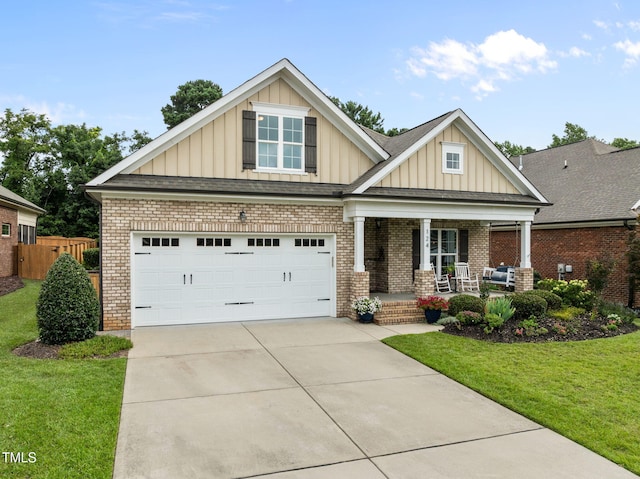 124 Moss Creek Pl, Fuquay Varina, NC 27526 - craftsman house with covered porch, board and batten siding, concrete driveway, and brick siding