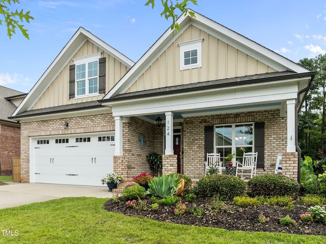 124 Moss Creek Pl, Fuquay Varina, NC 27526 - craftsman inspired home featuring board and batten siding, brick siding, covered porch, and a garage