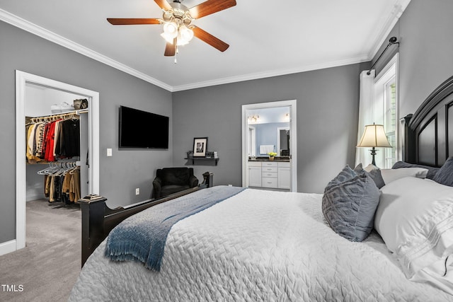 124 Moss Creek Pl, Fuquay Varina, NC 27526 - bedroom featuring a spacious closet, carpet floors, crown molding, a ceiling fan, and ensuite bathroom