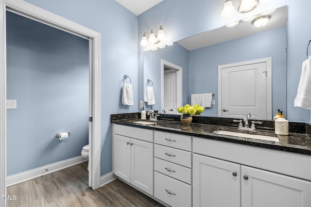 124 Moss Creek Pl, Fuquay Varina, NC 27526 - full bath featuring double vanity and wood finished floors