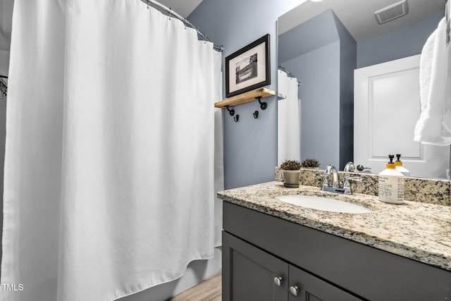 124 Moss Creek Pl, Fuquay Varina, NC 27526 - full bathroom featuring vanity, wood finished floors, and curtained shower