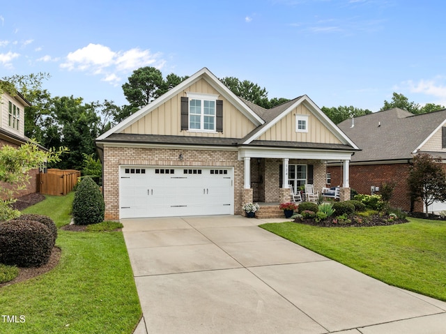 124 Moss Creek Pl, Fuquay Varina, NC 27526 - craftsman-style house featuring a porch, board and batten siding, concrete driveway, and brick siding