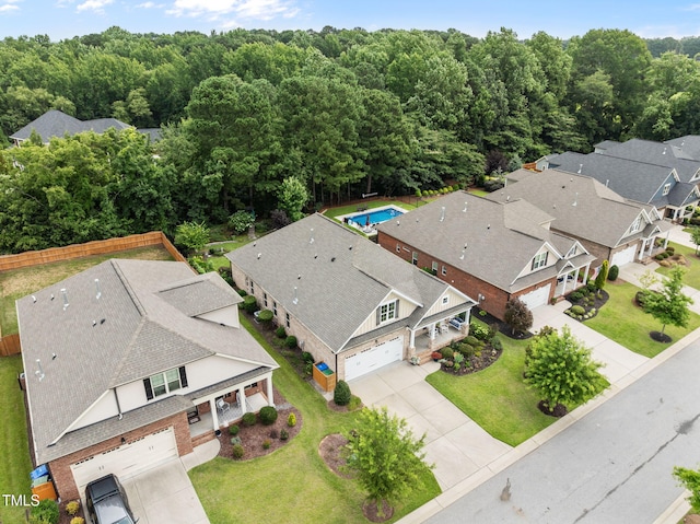 124 Moss Creek Pl, Fuquay Varina, NC 27526 - aerial view of residential area featuring a heavily wooded area