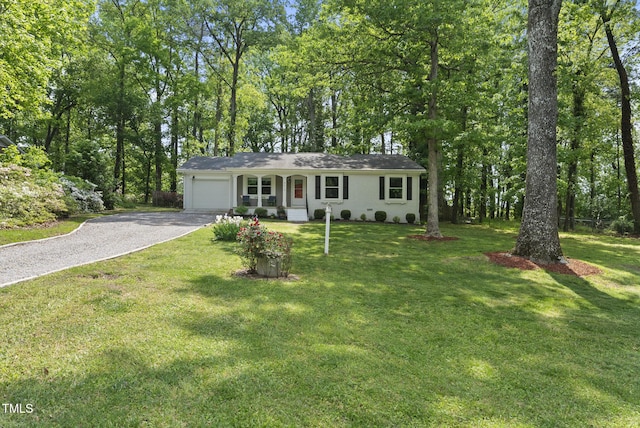 8613 Lobelia St, Raleigh, NC 27603 - single story home featuring driveway, a garage, and a front yard
