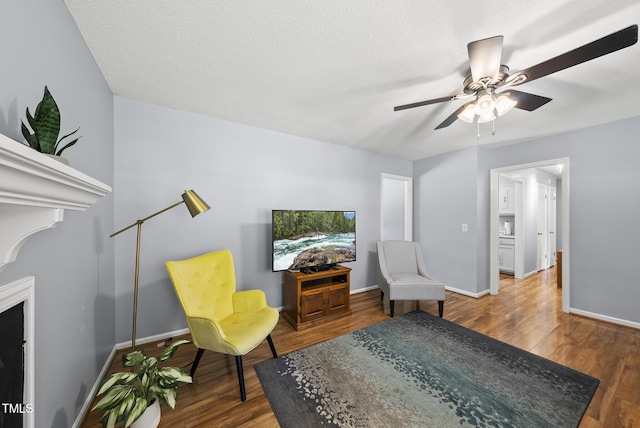 8613 Lobelia St, Raleigh, NC 27603 - living area with wood finished floors and ceiling fan