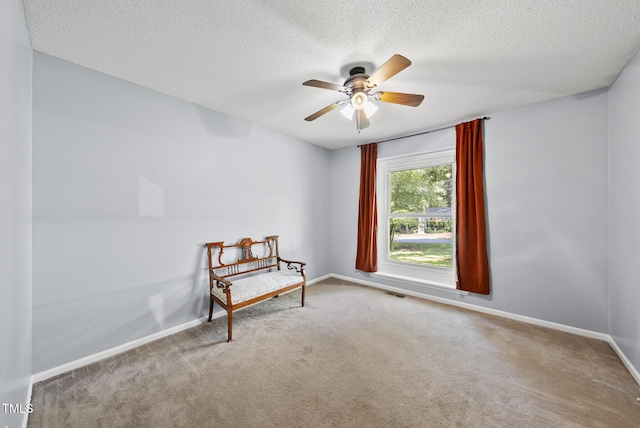 8613 Lobelia St, Raleigh, NC 27603 - unfurnished room featuring carpet floors, a ceiling fan, and a textured ceiling