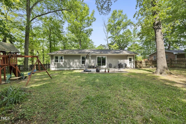 8613 Lobelia St, Raleigh, NC 27603 - back of house featuring a patio, a playground, a fenced backyard, and crawl space