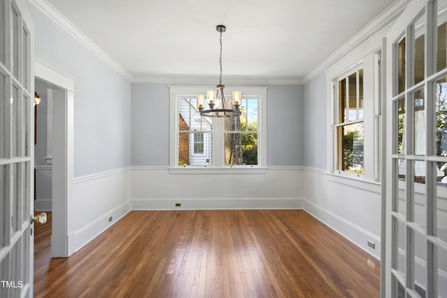 2005 Glenwood Ave, Raleigh, NC 27608 - spare room featuring a chandelier, dark wood-style flooring, and crown molding
