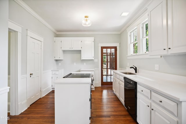 2005 Glenwood Ave, Raleigh, NC 27608 - kitchen featuring black dishwasher, dark wood-style flooring, a center island, white cabinets, and crown molding