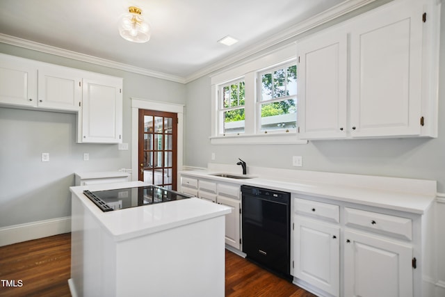 2005 Glenwood Ave, Raleigh, NC 27608 - kitchen with black appliances, white cabinetry, a center island, dark wood-style flooring, and ornamental molding