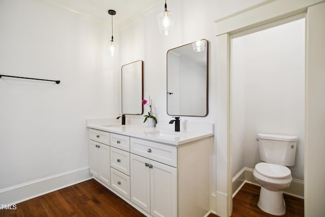 2005 Glenwood Ave, Raleigh, NC 27608 - bathroom featuring wood finished floors, double vanity, and ornamental molding