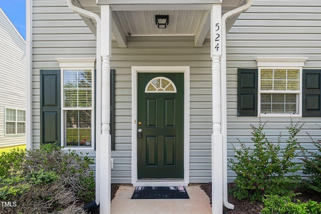 524 Summer Breeze Dr, Durham, NC 27704 - doorway to property with a porch