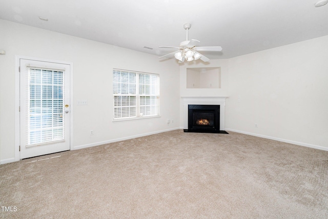 524 Summer Breeze Dr, Durham, NC 27704 - unfurnished living room with carpet flooring, ceiling fan, and a fireplace with flush hearth