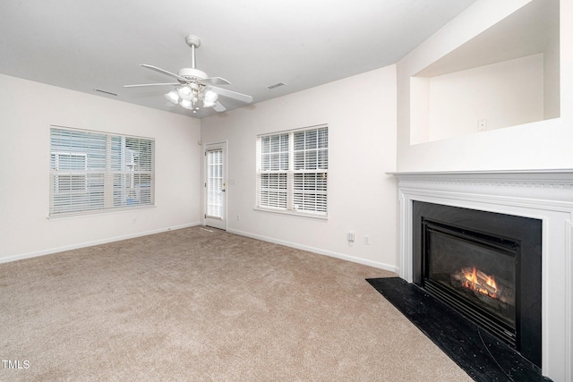 524 Summer Breeze Dr, Durham, NC 27704 - unfurnished living room with a fireplace with flush hearth, carpet, and a ceiling fan