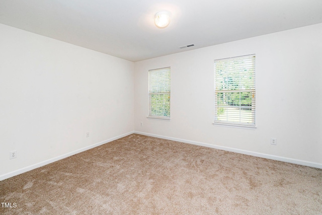 524 Summer Breeze Dr, Durham, NC 27704 - carpeted spare room with baseboards
