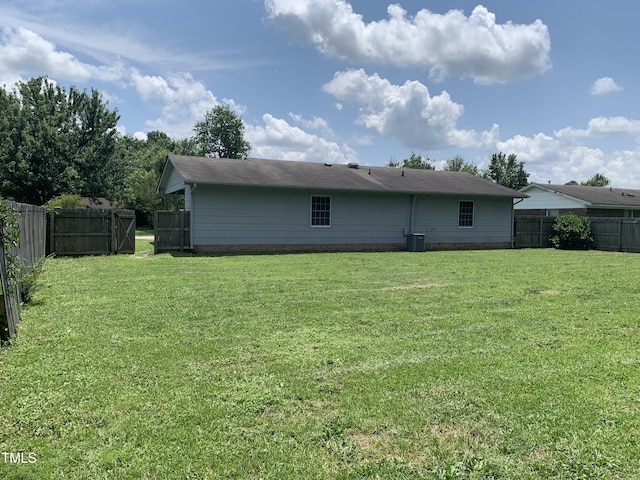 5574 Heather St, Hope Mills, NC 28348 - back of house with a fenced backyard