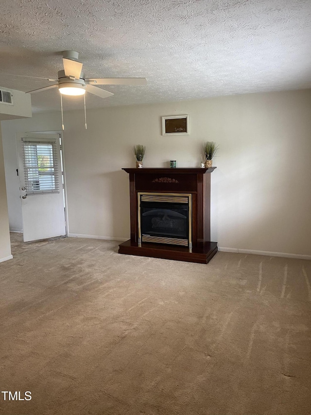 5574 Heather St, Hope Mills, NC 28348 - unfurnished living room featuring carpet floors, a glass covered fireplace, a ceiling fan, and a textured ceiling