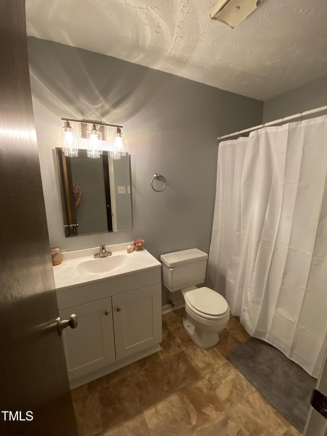 5574 Heather St, Hope Mills, NC 28348 - bathroom featuring vanity, a textured ceiling, and curtained shower