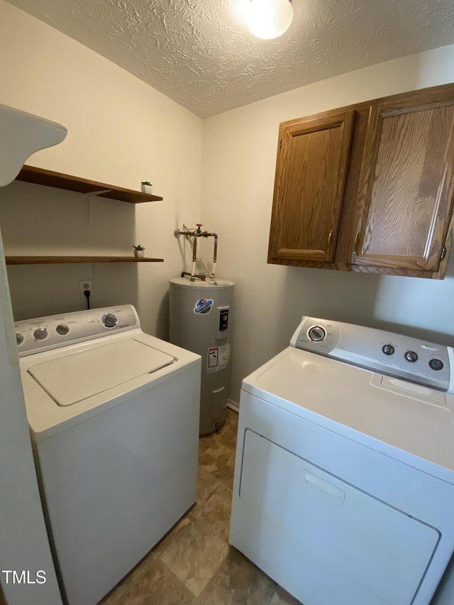 5574 Heather St, Hope Mills, NC 28348 - washroom featuring electric water heater, washing machine and dryer, cabinet space, and a textured ceiling