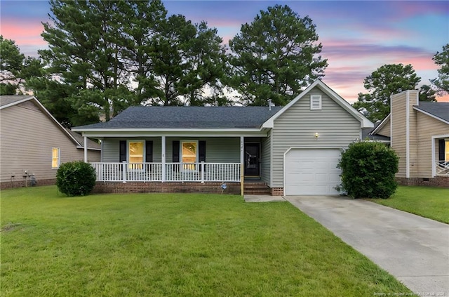 1591 Hazelcrest Dr, Fayetteville, NC 28304 - view of front facade featuring concrete driveway, covered porch, a garage, a front lawn, and roof with shingles